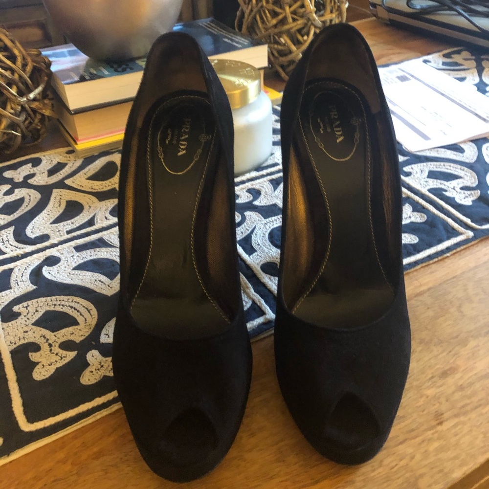 Prada one toe black suede heels.